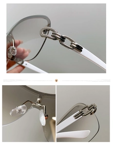 Detail view of square rimless sunglasses with silver chain hinge and grey gradient lenses