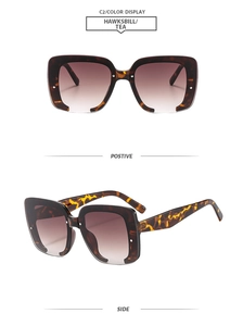Vue détaillée des lunettes de soleil carrées écaille avec verres dégradés marron et rivets