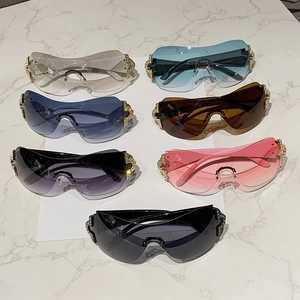 Detailed view of Y2K rimless oversized sunglasses with rhinestone accents in seven colors