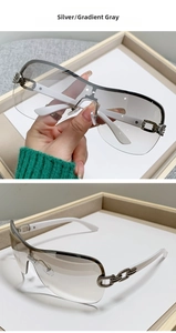 Detail of Y2K sunglasses with silver chain metal hinges and gradient gray lenses