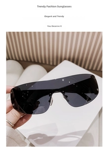 Close-up of frameless Y2K wraparound sunglasses featuring silver rivets and dark lenses
