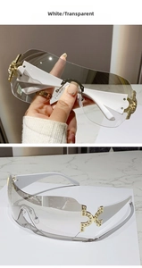 Detail of Y2K rimless sunglasses with rhinestone-encrusted gold hinge and white temples