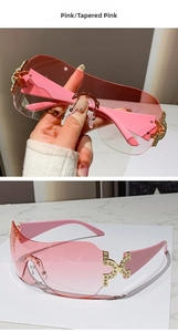 Detail of Y2K rimless one-piece pink gradient sunglasses with rhinestones and gold accents