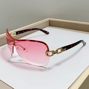 Modern Y2K square semi-rimless sunglasses with pink lenses and gold chain temples