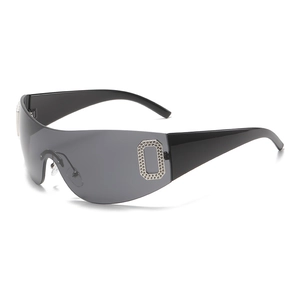 Y2K frameless oversized wrap-around sunglasses with rhinestone temple decor on white background