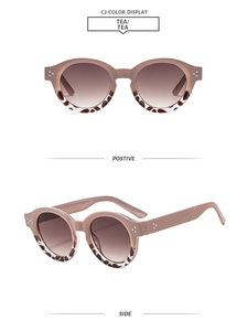 Detail der ovalen Sonnenbrille mit braunen Verlaufsgläsern und Schildpattmuster-Rahmen