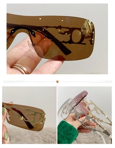 Macro view of Y2K rimless sunglasses featuring hollow metal flame-shaped temples