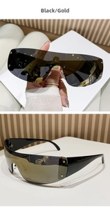 Detail view of Y2K rimless sports sunglasses featuring black arms and gold mirrored lenses