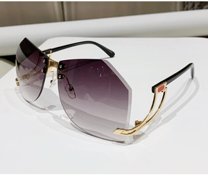 Top view of rimless Y2K sunglasses with purple gradient lenses and gold metal details