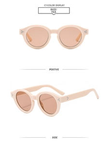 Retro-Ovale Sonnenbrille mit Reisnagel-Nieten in beigem Rahmen und Teegläsern