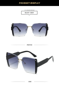 Detail view of rimless square sunglasses with grey gradient lenses and diamond texture temples