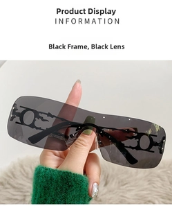Close-up of Y2K rimless sunglasses with black metal frame and flame cutout details