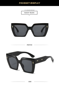 Lunettes de soleil carrées oversize noires avec détails élégants en métal doré