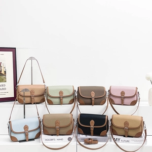 Minimalist pebbled leather crossbody bags in various colors with elegant buckle detail