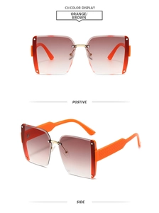 Detail view of square rimless sunglasses with orange gradient lenses and metal bridge