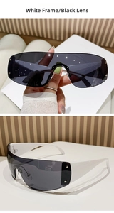 Detail view of white frames and dark grey shield lenses with star accents