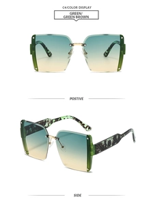 Macro view of green gradient rimless sunglasses with gold metal hinges and leopard temples