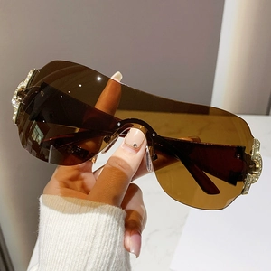 Chic Y2K rimless oversized sunglasses with brown gradient lenses and rhinestone accents