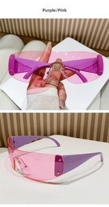 Detail of pink Y2K sunglasses with silver star accents and purple temples
