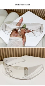 Close-up of white frame shield sunglasses with transparent lenses and metal bridge