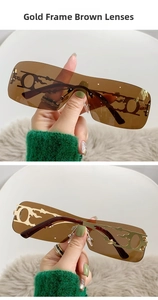 Detail of gold frame brown lens sunglasses with Y2K flame cutout metal decorations