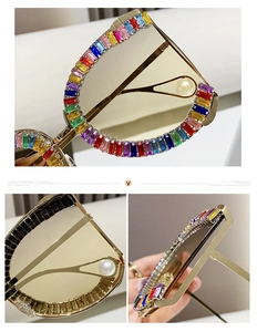 Detailed macro of gold metal frame sunglasses with rainbow rhinestones and pearl temple