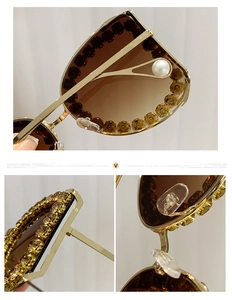 Detailed view of luxury oversized gold sunglasses with crystals, gradient lenses and pearl