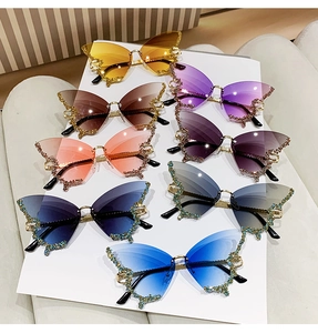 Frameless butterfly wing sunglasses with sparkling rhinestones in multiple gradient colors