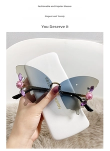 Detail of rimless butterfly sunglasses with grey-blue gradient lenses and floral crystals