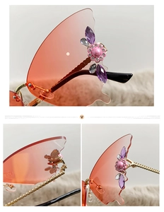 Detail of rimless butterfly sunglasses with orange gradient lens and diamond flower accent
