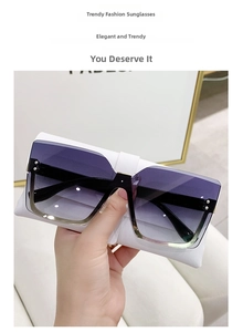 Detail of rimless square sunglasses with purple gradient lenses and gold metal trim