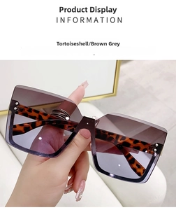 Detail of rimless square sunglasses featuring tortoiseshell frames and gradient lenses