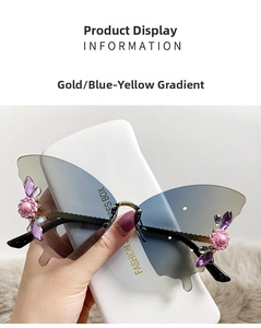Detail of rimless butterfly sunglasses with blue-yellow gradient and floral rhinestone decor