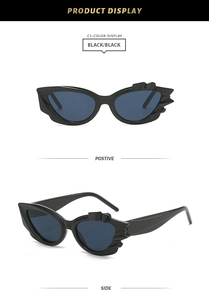 Detailansicht der schwarzen Cat-Eye-Sonnenbrille mit unregelmäßigen gezackten Kanten