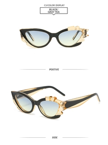 Detailansichten der schwarzen Cateye-Sonnenbrille mit bernsteinfarbenen Akzenten und Verlauf