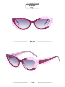 Detailansicht der lila Cat-Eye-Sonnenbrille mit flammenförmigem Rahmen und grauen Gläsern