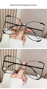 Detail of oversized D-frame glasses with clear lenses and pearl trim on lower rims