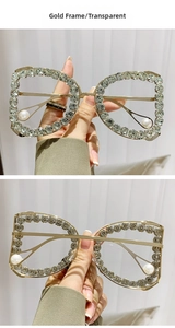 Detail of luxury gold D-frame glasses with crystals and pearl temple accents