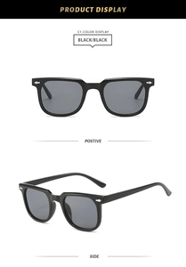 Detail view of black square frame sunglasses with silver arrow rivets and dark lenses
