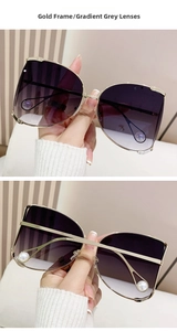 Detail of gold metal D-frame sunglasses with gradient lenses and pearl temple accents