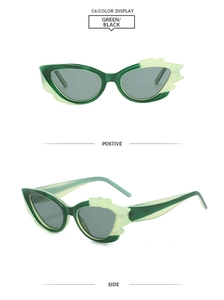 Detailansicht der transparenten grünen Cat-Eye-Sonnenbrille mit flammenden Zierrahmen