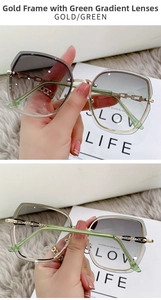 Detail of butterfly-shaped rimless sunglasses with gold metal frame and green gradient lenses