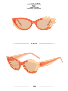 Detailansicht der roten Cat-Eye-Sonnenbrille mit champagnerfarbenen Gläsern und Flammenkanten