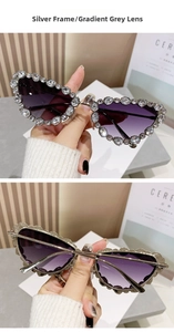 Macro detail of luxury silver cat-eye sunglasses with gradient lenses and oversized rhinestones