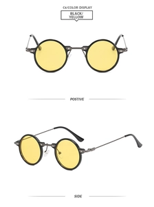 Detail view of round metal sunglasses with black frames and yellow tinted lenses