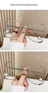 Detailed view of silver metal D-frame glasses featuring unique pearl drop temple tips