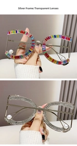 Detail of silver D-frame glasses with colorful rhinestones and hanging pearl accents