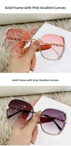 Detail view of gold-rimmed butterfly sunglasses with rhinestones and chain temples