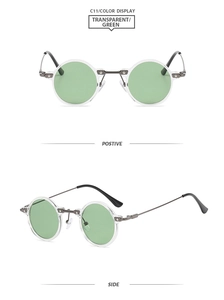 Detail view of round vintage glasses with transparent frames and light green lenses