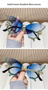 Detailed view of butterfly rimless sunglasses with blue gradient lenses and rhinestones